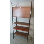 Mid century teak Ladderax wall unit featuring a fall front cabinet section and slide out writing