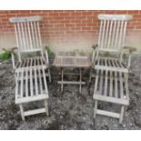 A pair of good quality slatted teak steamer chairs and table, together with seat cushions.
