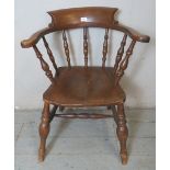 A antique ash and elm smoker's bow/gentleman's armchair, with nicely turned spindles,