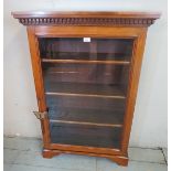 A 19th century mahogany bookcase with dentil moulded cornice,