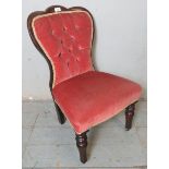 A late Victorian mahogany framed button back child's chair upholstered in a pink velvet material,