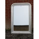 A large vintage overmantle mirror painted silver in a 'distressed' finish,