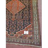 A late 19th/early 20th Century Persian rug. 187cm x 127cm.
