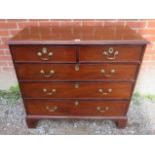 A Georgian mahogany chest of two short over three long cock beaded drawers,