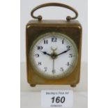 A small brass cased antique alarm clock