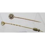 A rough cut diamond stick pin with fasci