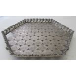 An unusual hexagonal white metal tray wi
