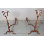 A pair of antique wrought iron fire grat