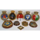 Nine cast ship's crest plaques plus a ca