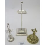 A collection of three hatpin stands, a s