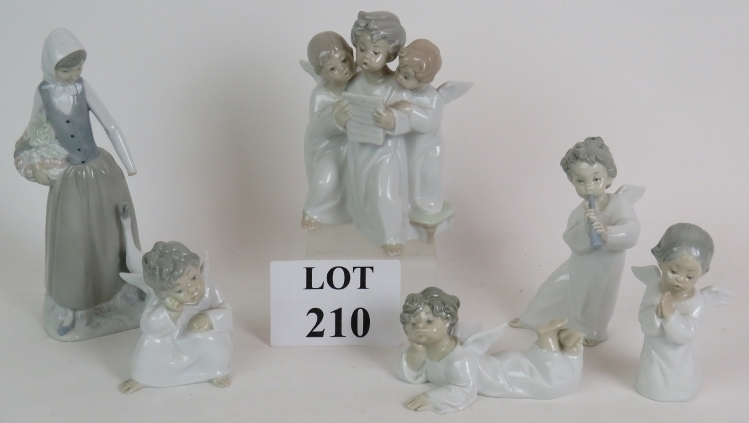 A Lladro figure of a three angel choir a