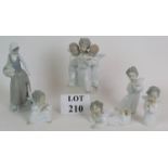 A Lladro figure of a three angel choir a