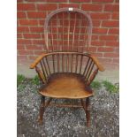 An oak stick back Windsor style chair wi
