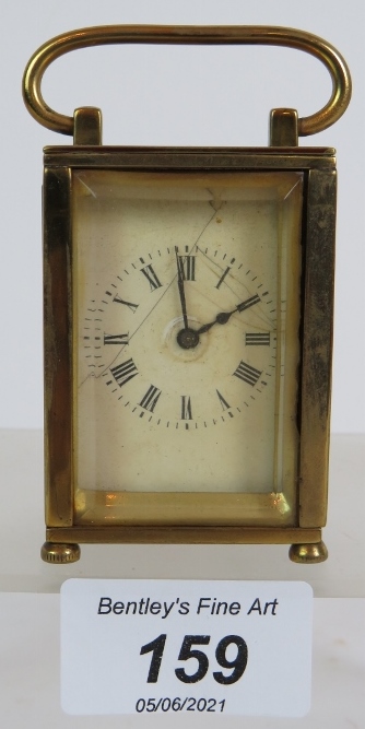 A miniature French brass carriage clock