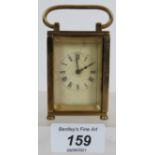 A miniature French brass carriage clock
