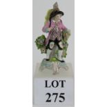 A finely decorated porcelain figure in t