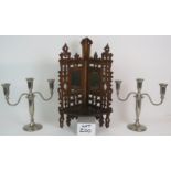 An antique carved oak folding corner she