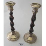 A pair of wooden barley twist candlestic