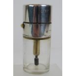 A glass atomizer with silver top and col