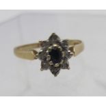 A 9ct yellow gold flower set ring with s