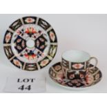A Royal Crown Derby Imari pattern trio of plate cup and saucer dated marked for 1914. (3).