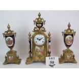 An ornate Italian Imperial brass and porcelain clock garniture in 18th Century style with striking