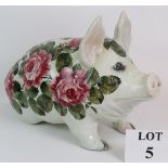 A large early 20th Century Wemyss Ware pottery pig decorated in cabbage rose pattern and hand