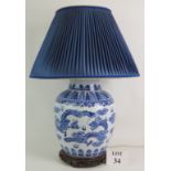 A 20th Century Chinese blue and white porcelain jar lamp decorated with dragons.