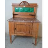 A French antique pine marble topped washstand with carved & pierced cornice & inset green glazed