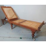 A Victorian walnut framed articulated campaign daybed by Robinson & Sons of Ilkey, Yorkshire,