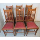 A set of six oak framed Arts & Crafts high back dining chairs by Liberty of London,