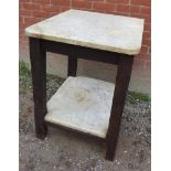 A rustic oak framed two tier marble topped kitchen counter/pastry station with a marble under tier,
