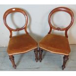 A pair of Victorian walnut framed balloon back occasional chairs,