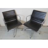 A pair of Eames EA 108 style swivel offices chairs,