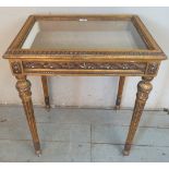 An ornate reproduction giltwood bijouterie table in the 18th century French taste,