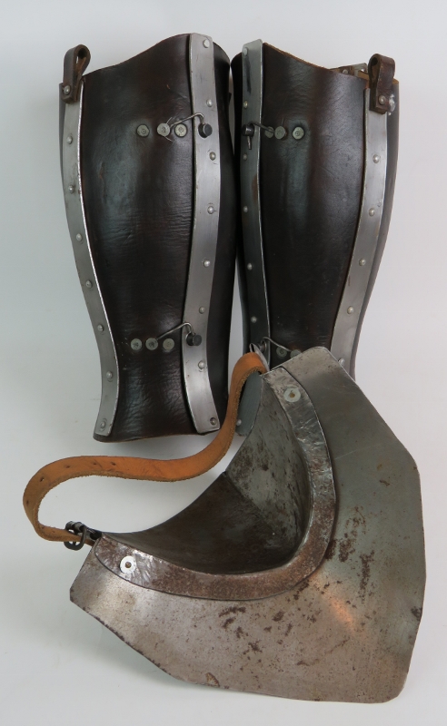 A medieval re-enactment pair of leather and steel leg guards, a steel throat protector, - Image 6 of 14