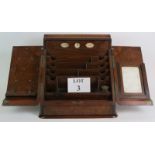 A 19th Century burr walnut desk top stationery cabinet with perpetual calendar,