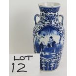 A late 18th/early 19th Chinese porcelain vase hand decorated in the Kangxi style with cartouches