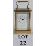 A Garrard and Co brass cased 8 day carriage clock with inscription to reverse. No key. Height: 15.