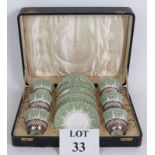 A 1930's boxed tea set of Hammersley & Co cups and saucers with hallmarked silver holders.