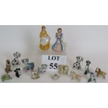 A collection of Wade pottery Disney characters including Scamp, Lady, Cinderella, Beauty,