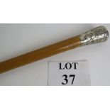 A Chinese white metal topped antique walking cane with Malacca shaft and brass ferule. Length: 92cm.