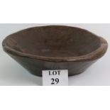 An 18th/19th Century large English carved oak bowl hewn from one piece of oak. Diameter: 48cm.