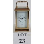 A good quality St James brass cased 8 day carriage clock with inscription to base. No key.