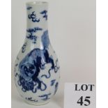 An antique Chinese porcelain bottle vase hand decorated with dogs of fo. Possibly late 18th Century.
