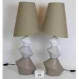 A pair of contemporary Asymmetric pebble style lamps by Laurie Lamps with matching Asymmetric