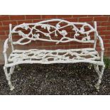 A 19th century white painted cast iron garden bench in the manner of Coalbrookdale,