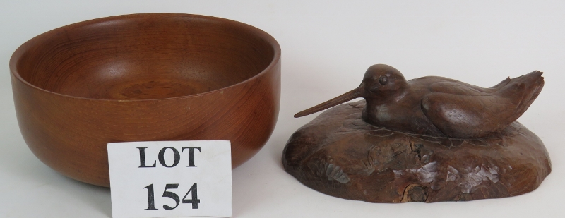 A very well carved figure of a sitting woodcock, carved from mulberry wood 1993 and a turned teak