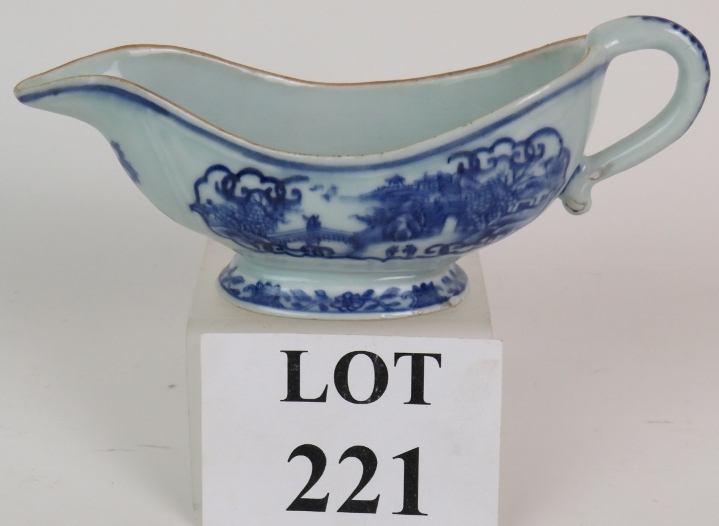 A late 18th/early 19th Century Chinese porcelain sauce boat with blue hand painted decoration.