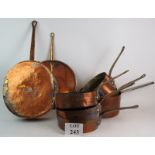 Seven large heavy copper pans most marked Dorchester Hotel, made by Leon Jaeggi & Sons, plus one lid